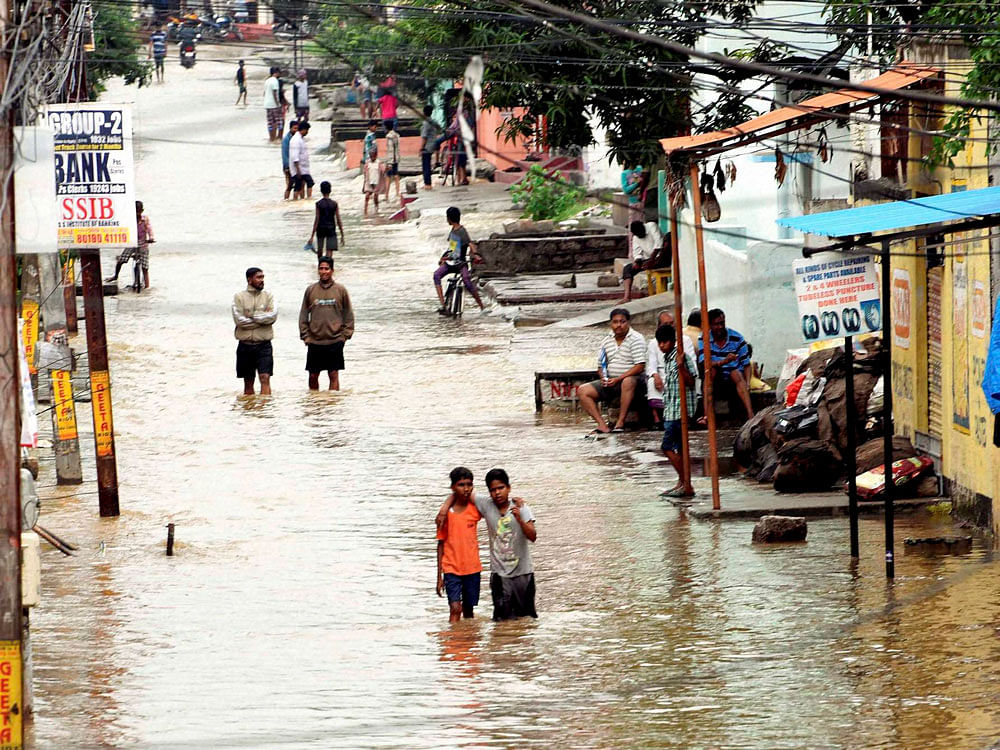 With heavy rains throwing normal life out of gear in Hyderabad and other parts of Telangana, Chief Minister K Chandrasekhar Rao had earlier ordered officials to set up control rooms in all the districts to reach out to the marooned people with necessary relief. PTI photo
