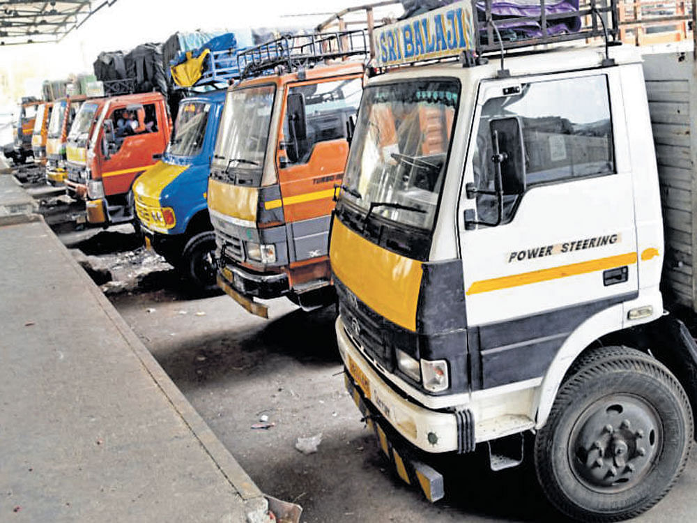 Lorries line up at the Yeshwantpur APMC yard during a strike against the massive hike in vehicle insurance cost on Wednesday. dh Photo