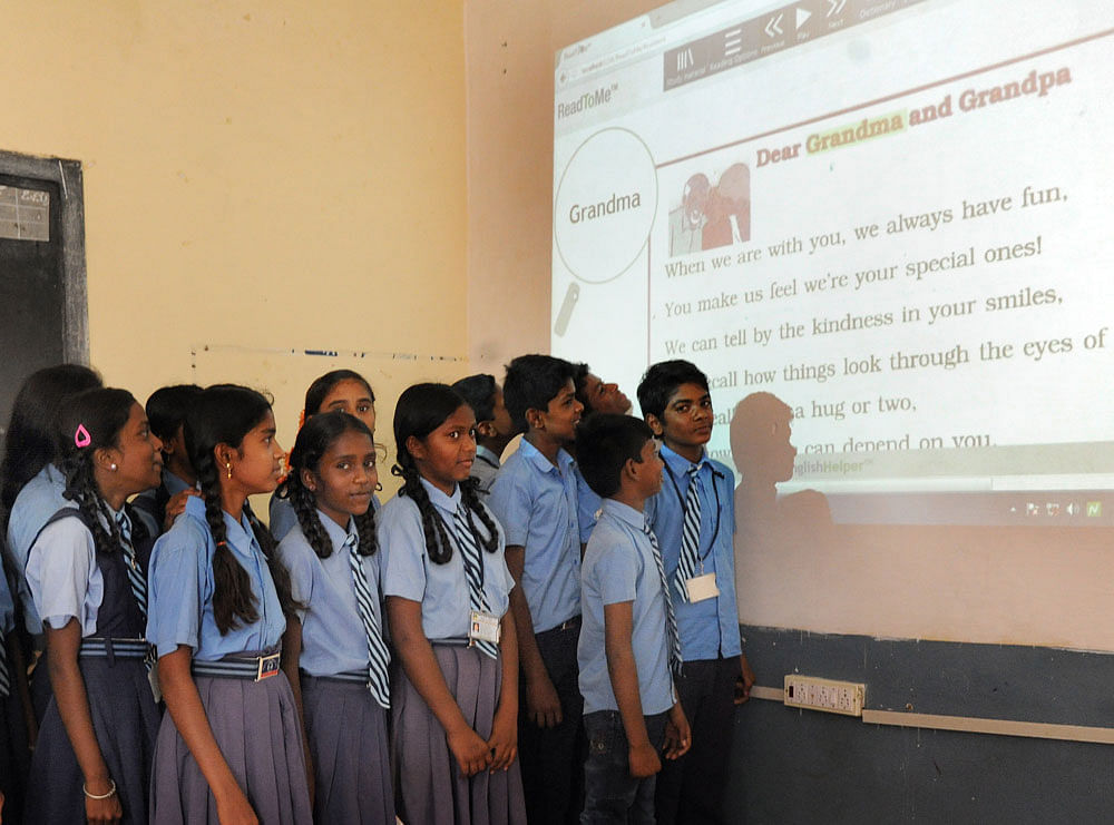 Students at Government Higher Primary School in Channasandara, Bengaluru, learn English through ReadToMe, a  sophisticated technology platform.