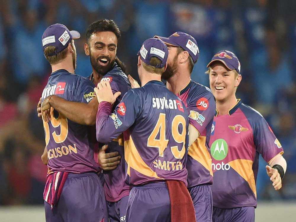 Rising Pune Supergiants Jayadev Unadkat with team mates celebrate the wicket of Lendl Simmons during the IPL 10 Final match between Rising Pune Supergiants and Mumbai Indians in Hyderabad on Sunday. PTI Photo