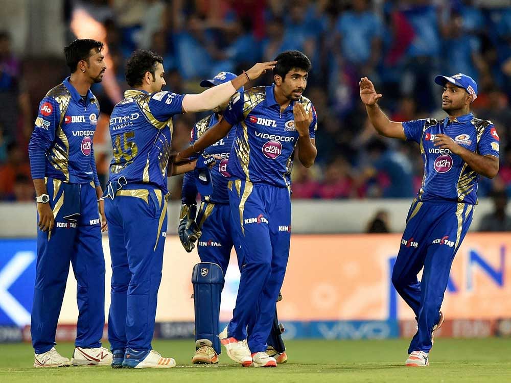 Mumbai Indians Jasprit Bumrah with team mates celebrate the wicket of M S Dhoni during the IPL 10 Final match between Rising Pune Supergiants and Mumbai Indians in Hyderabad on Sunday. PTI Photo