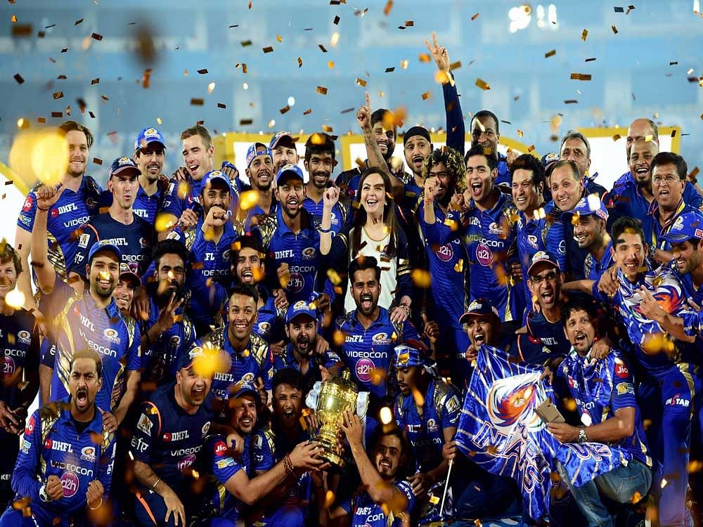 Mumbai Indians players and Owner Neeta Ambani with IPL 10 trophy after they win the IPL 10 Final match against Rising Pune Supergiants in Hyderabad on Sunday. PTI Photo