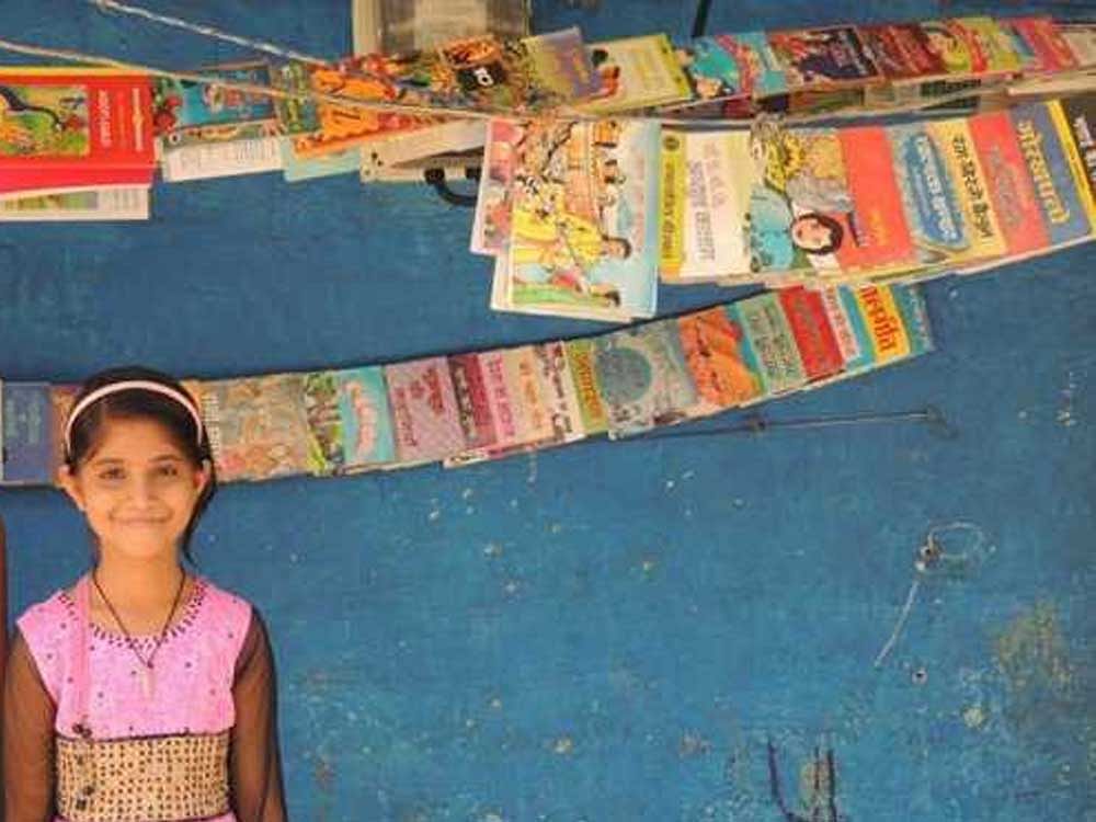 Muskan Ahirwar started the small library - 'Bal Pustakalaya' - with 25 educational books last year at her residence in Durga Nagar, a slum located barely a kilometre away from the state secretariat in Bhopal. Image Courtesy: Twitter