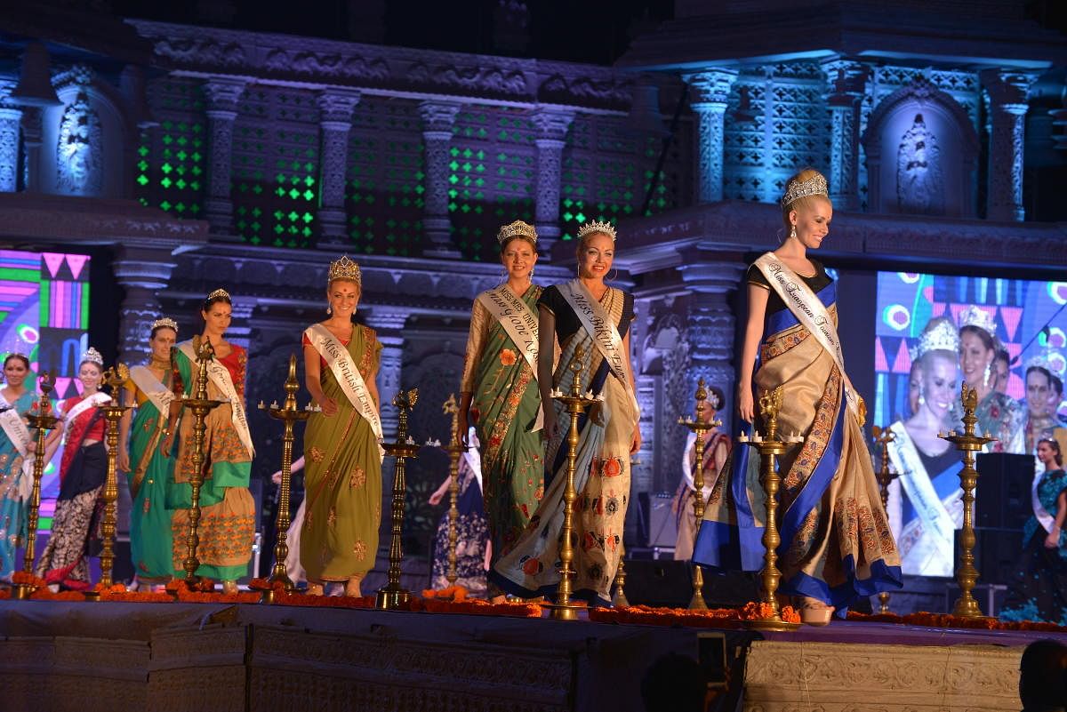 Former Miss Worlds in traditional Indian attire walk the ramp at the Hampi Utsav in the wee hours of Sunday. dh photo