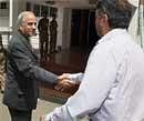 Chairman of the five member Srikrishna Committee on Telangana issue, Justice B N Srikrishna shakes hands with a panel member V K Duggal in New Delhi on Friday. PTI