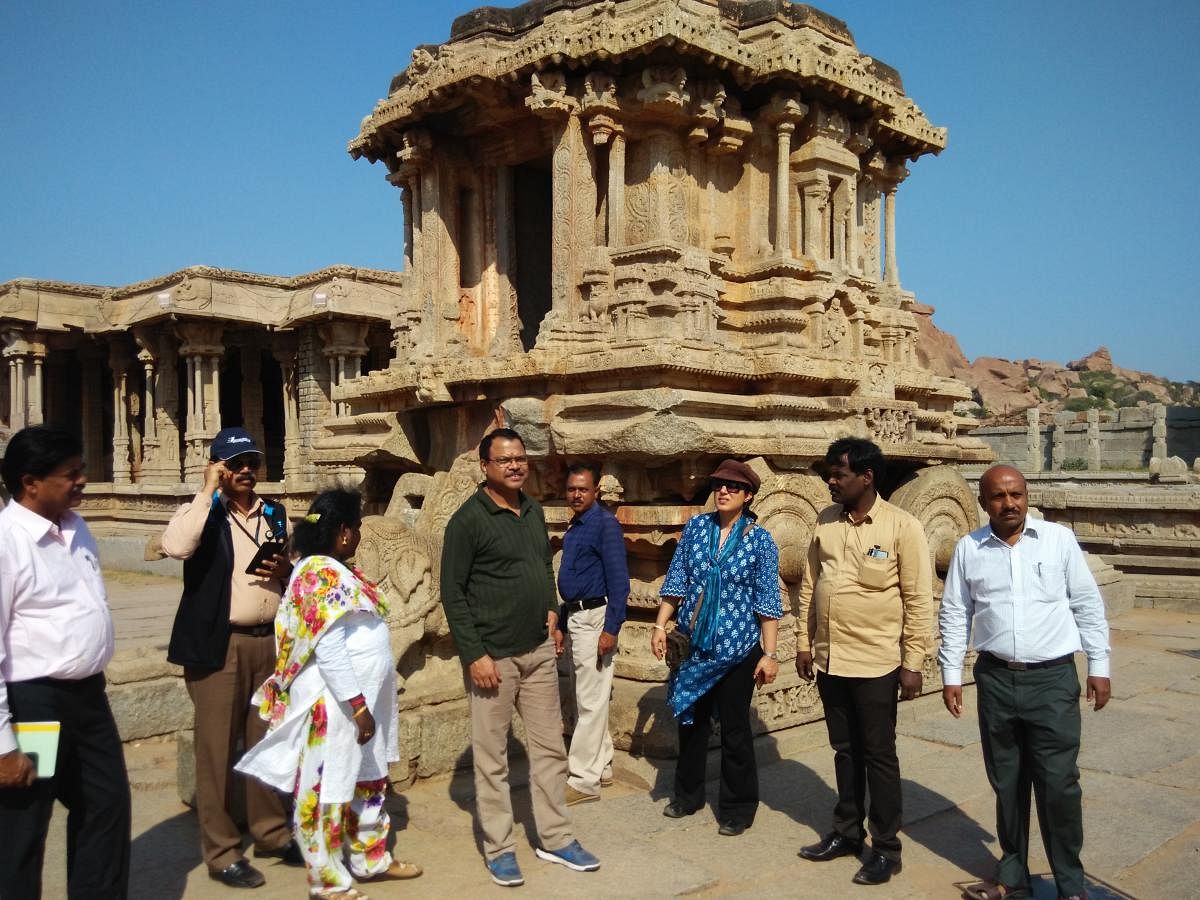 Officials from the union ministry of culture, ASI and BEL at the stone chariot in Hampi recently. dh photo