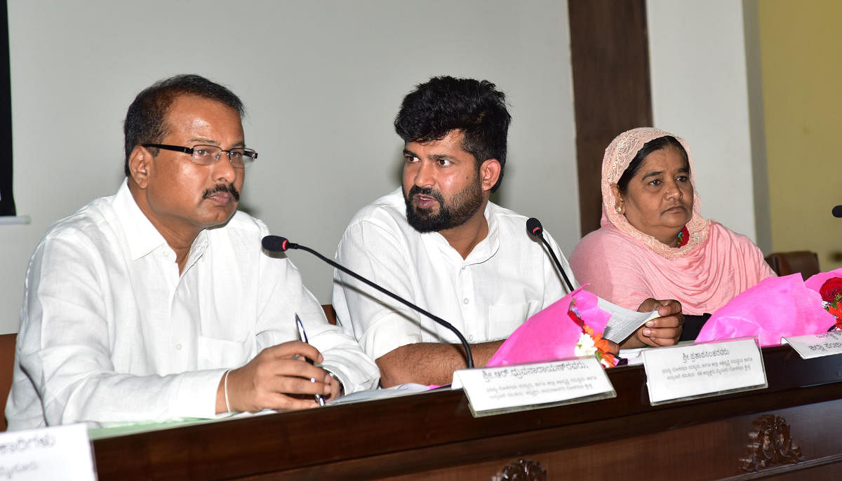 Chamarajanagar MP R Dhruvanarayan, Mysuru-Kodagu MP Pratap Simha and ZP president Nayeema Sultana at a Monitoring Committee meeting in Mysuru on Tuesday. dh photo