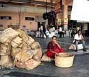 A woman waits at a bus terminal during a bandh called by pro-Telengana activists in Hydrabad on Saturday. PTI