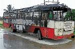 The bus that was torched by villagers in Alur. DH Photo