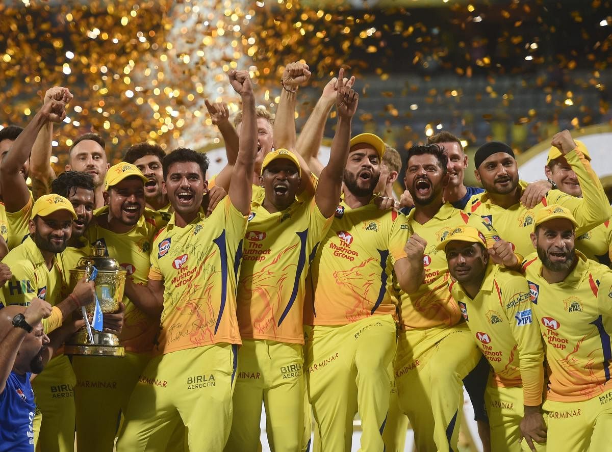 Chennai Super Kings players celebrate with the IPL 2018 trophy after winning the final match against Sunrisers Hyderabad, in Mumbai on Sunday. CSK defeated SRH by eight wickets to lift the trophy. PTI