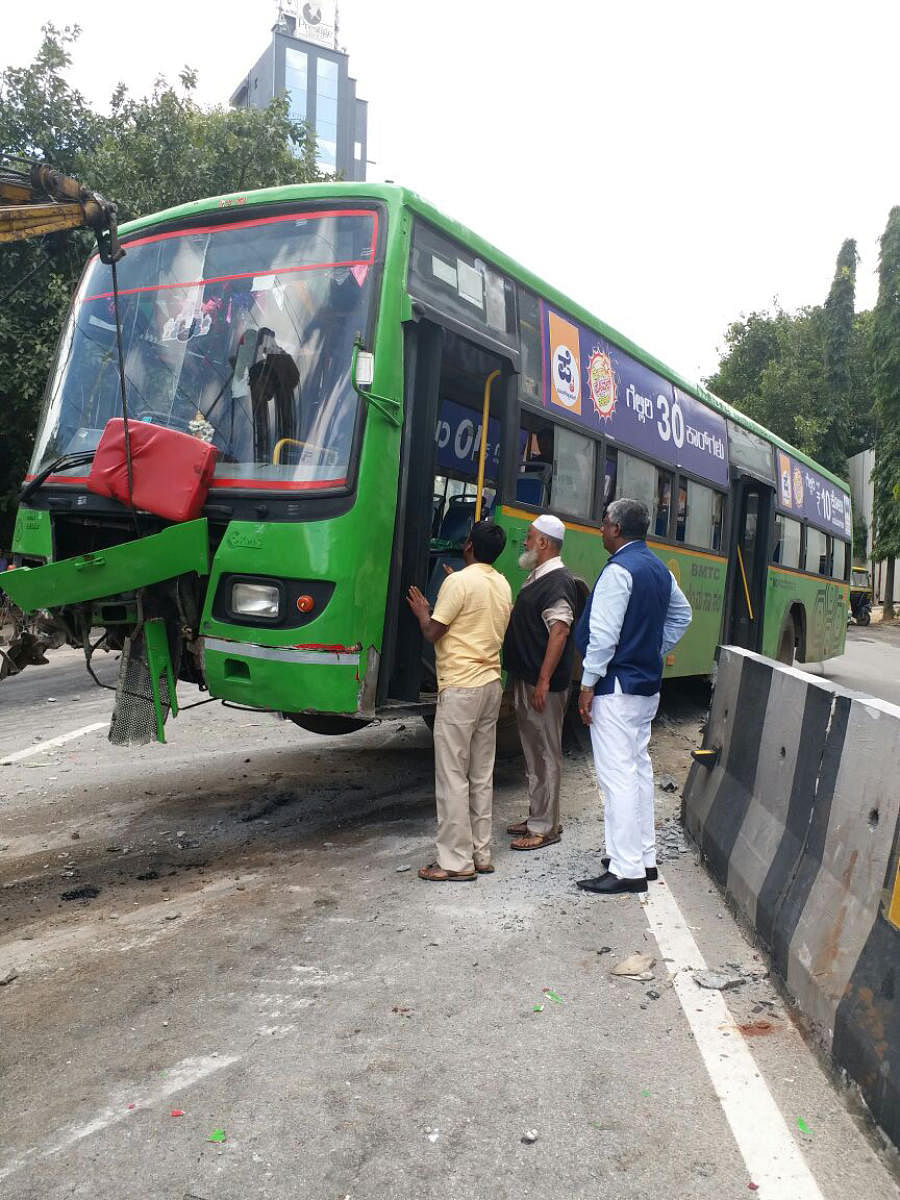 BMTC bus after the driver lost control and rammed the vehicle into the divider on the busy Kasturba Road on Tuesday morning. DH Photo