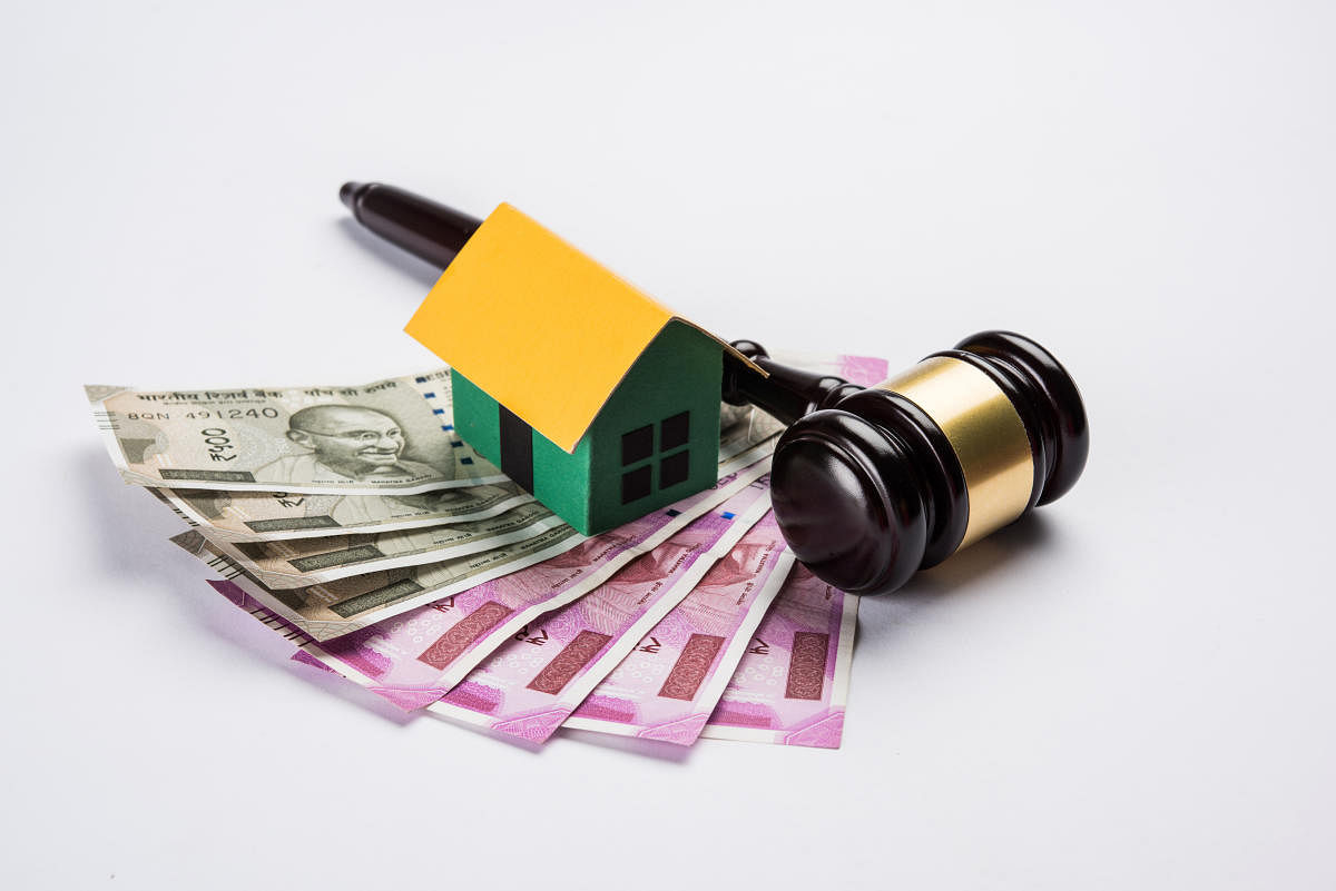 stock photo of india and real estate law, Indian law for real estate / construction company / architects / builders or buyers showing small house model, gavel / hammer, indian currency notescourt