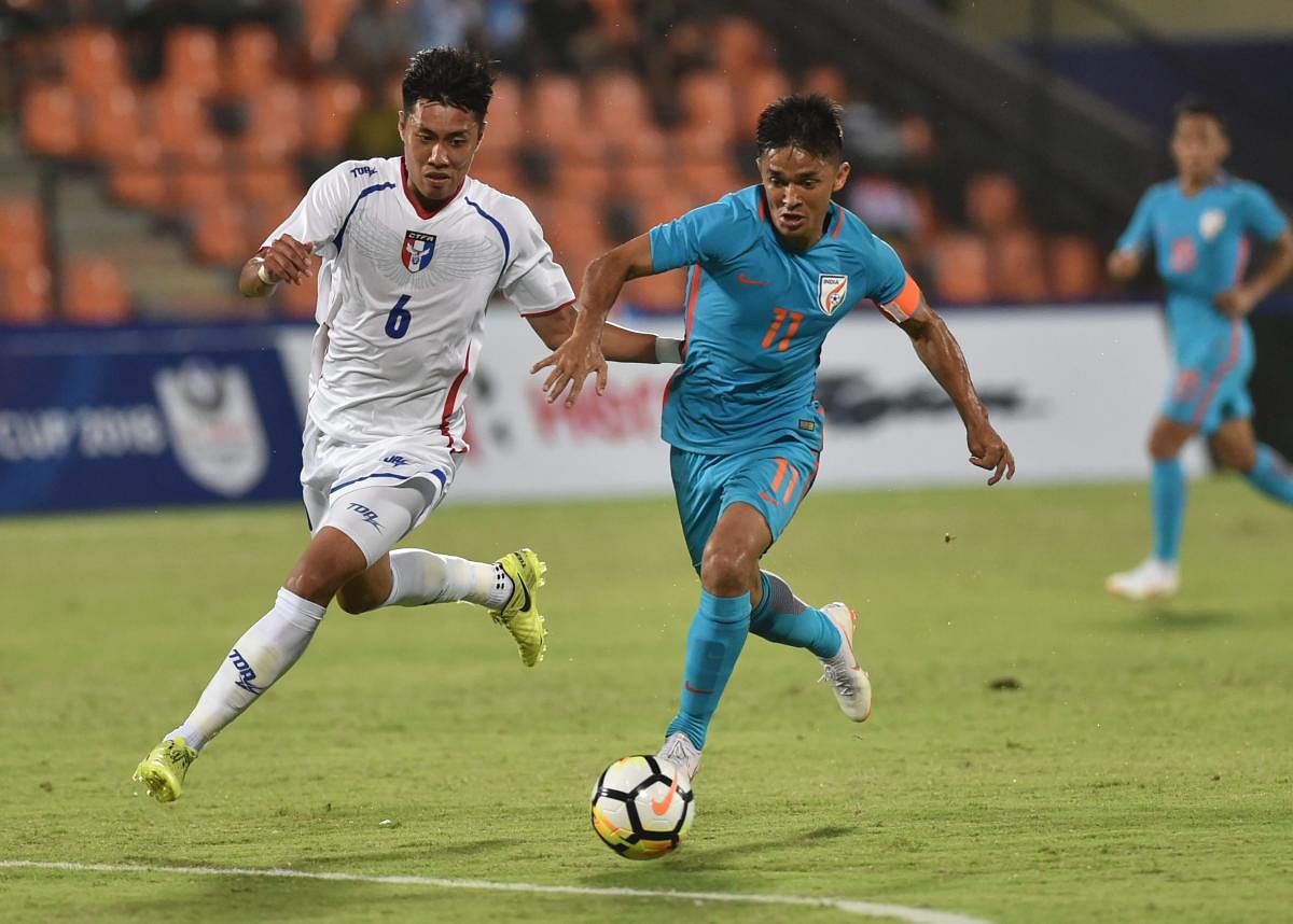 Indian player Sunil Chhetri (Blue jersey no. 11) and Chinese Taipei player Wei-Chuan Chen (White jersey no. 6) vie for the ball during the Hero Intercontinental football Cup in Mumbai on Friday, June 1, 2018. (PTI Photo / Mitesh Bhuvad)