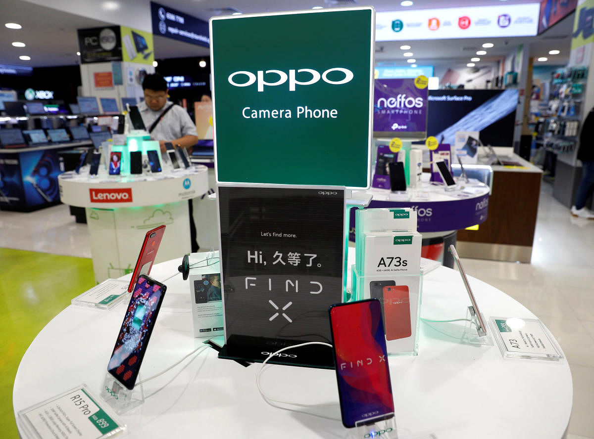 Oppo smartphones are displayed in a shop in Singapore