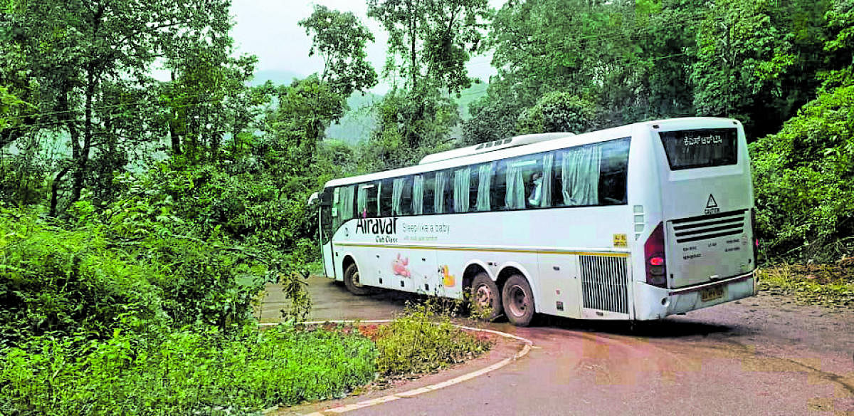 A KSRTC Volvo bus negotiating a sharp curve near Kalasa.