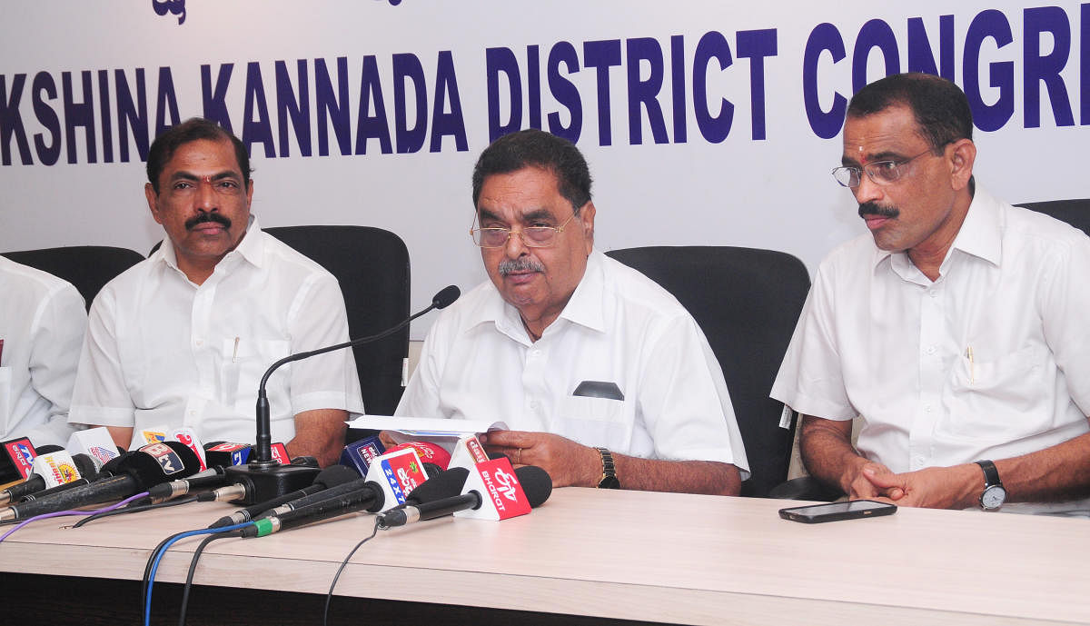 Former minister B Ramanath Rai speaks to reporters in Mangaluru on Monday.