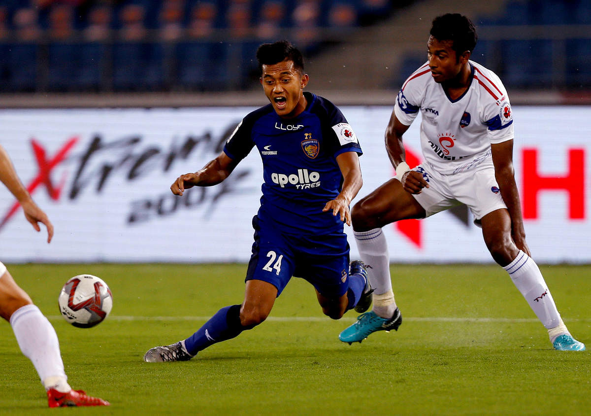 Chennaiyin FC's Isaac Vanmalsawma (left) reacts after being tackled by Delhi Dynamos FC's Rana Gharami during their match in New Delhi on Tuesday. PTI