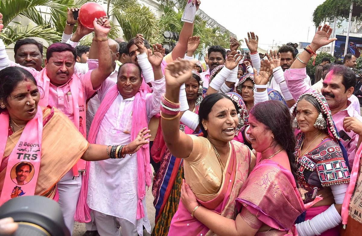 Telangana Rashtra Samithi (TRS) workers celebrate their party's victory in the states Assembly elections, at Telangana Bhavan in Hyderabad, on Tuesday. PTI