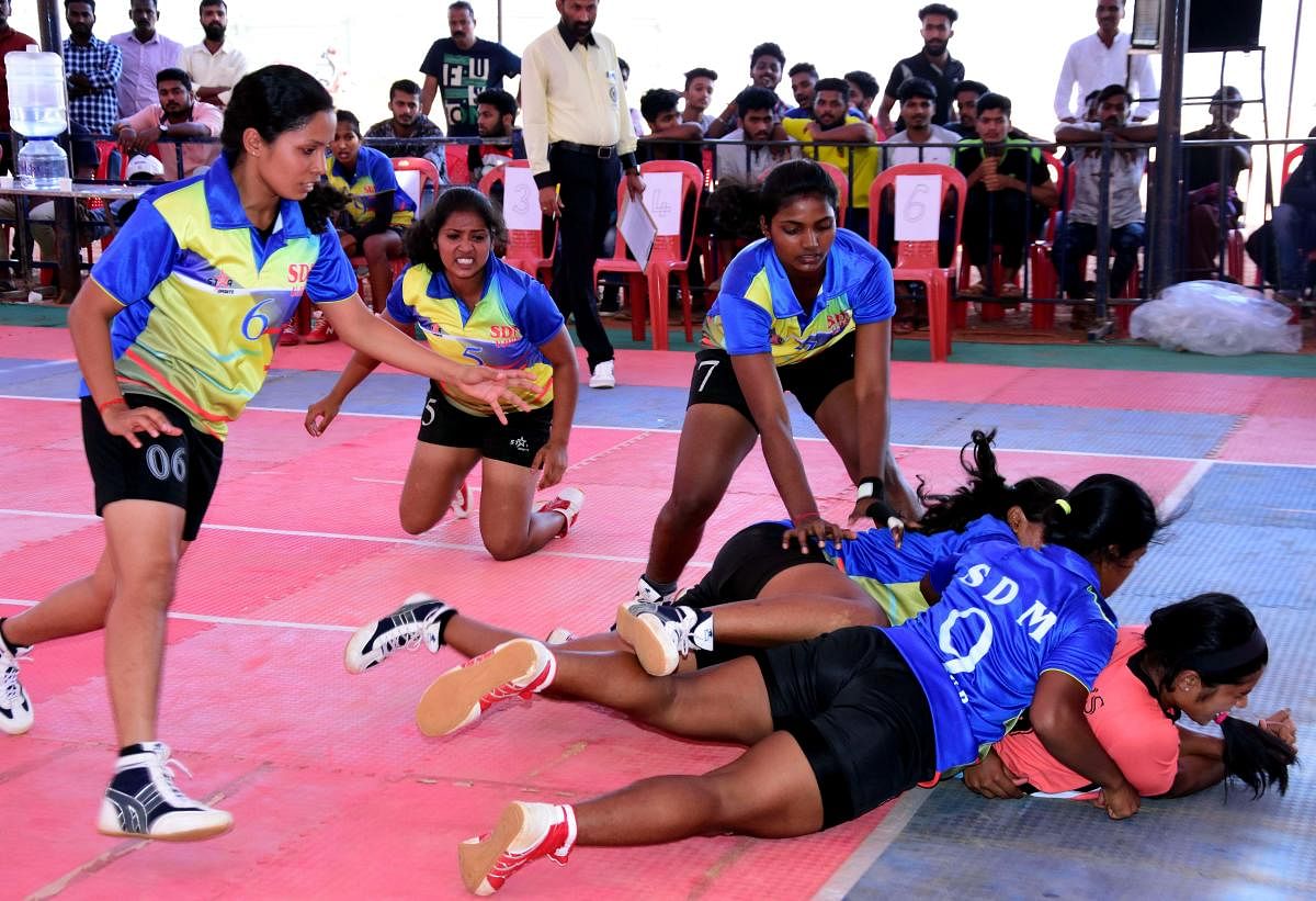 Kabaddi players in action at the district-level championship at Karavali Utsav grounds in Mangaluru.