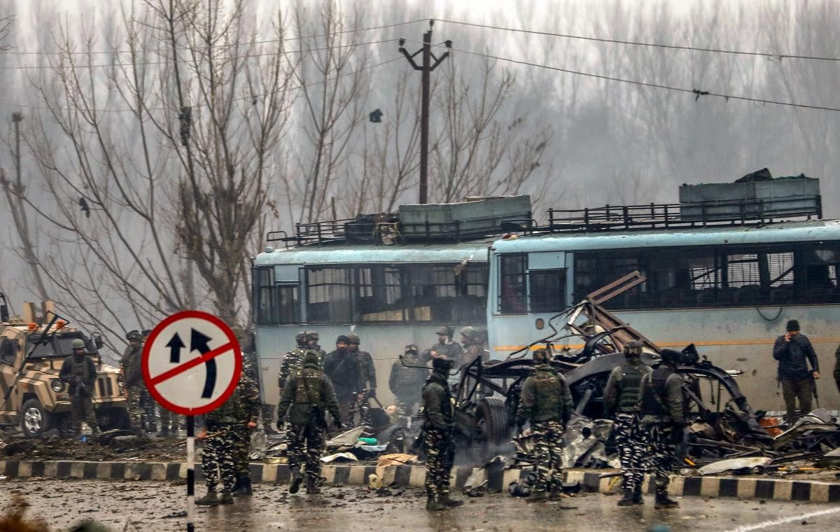 Security personnel carry out rescue and relief works at the site of a suicide bomb attack at Awantipora in Pulwama district of south Kashmir on February 14. 49 CRPF jawans were killed and dozens other injured in the attack. PTI