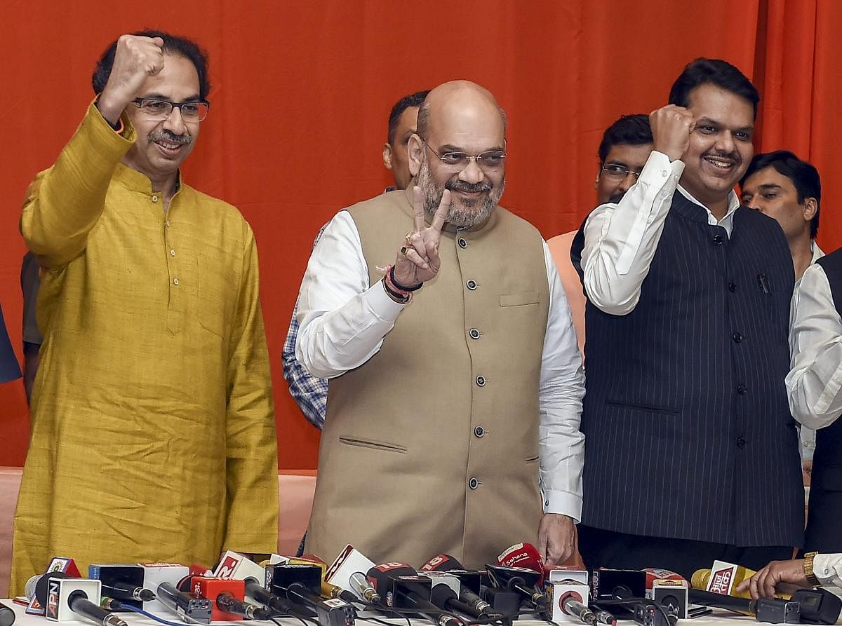 BJP President Amit Shah flanked by Shiv Sena President Uddhav Thackeray and Maharashtra Chief Minister Devendra Fadnavis during the announcement of an alliance between Shiv Sena and BJP for Lok Sabha and Assembly polls, in Mumbai. (PTI Photo)