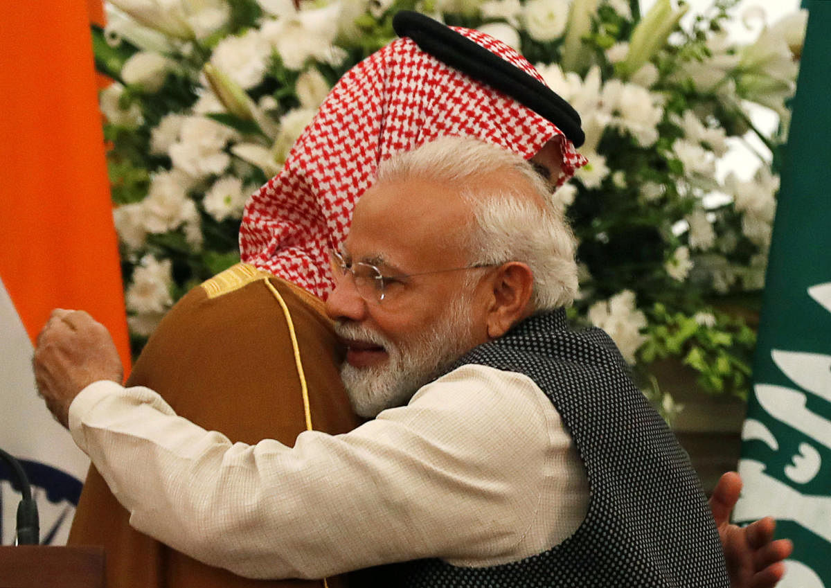 Prime Minister Narendra Modi hugs Saudi Arabia's Crown Prince Mohammed bin Salman during their meeting at Hyderabad House in New Delhi. REUTERS