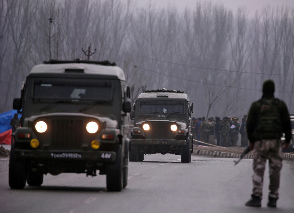 FILE: Soldiers stand guard near the site of the suicide bomb attack in Lethpora in south Kashmir's Pulwama district on February 15, 2019. REUTERS