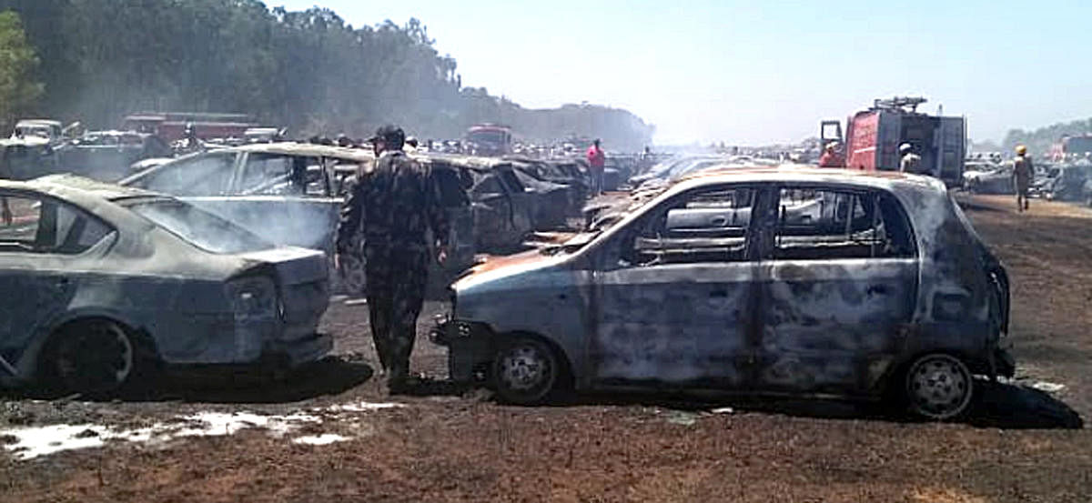 The remains of the cars after the massive fire at the parking lot of Aero India 2019 at Yelahanka airbase in Bengaluru on Saturday. DH Photo