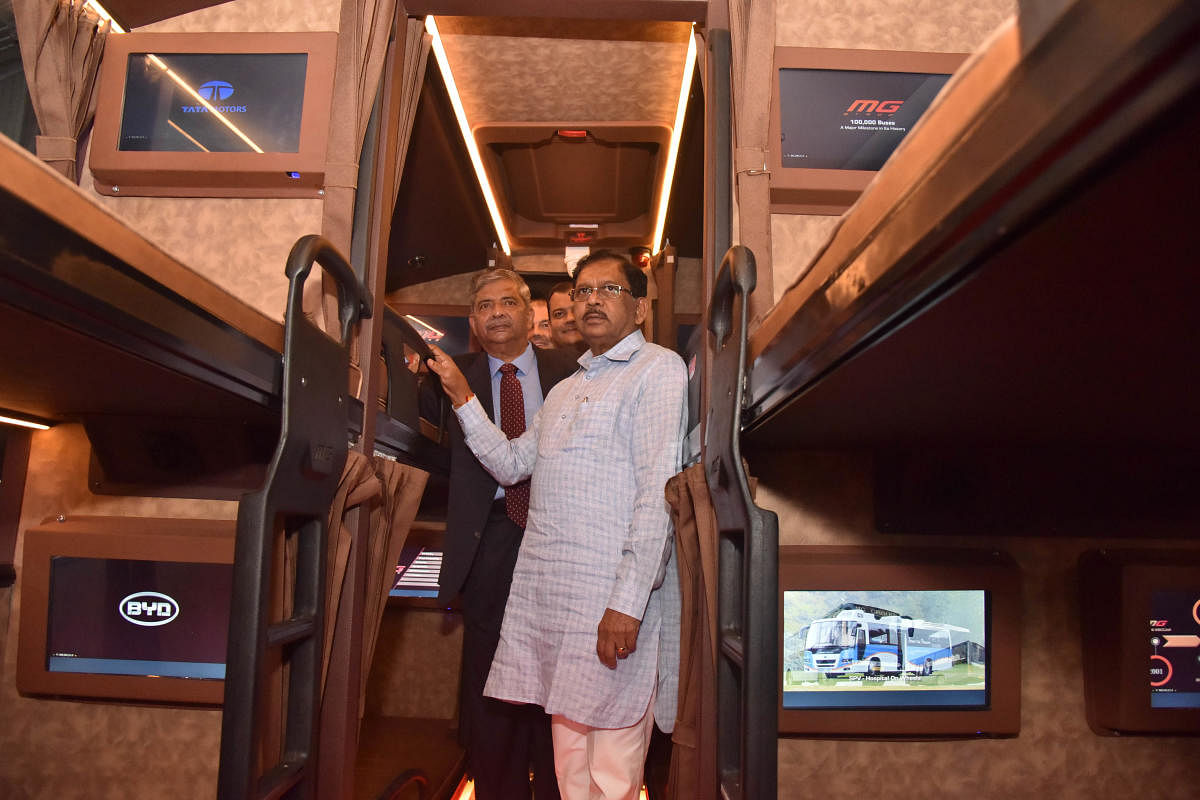 Deputy Chief Minister G Parameshwara looks at the interiors of a Bharat Benz bus after the inauguration of the 8th edition of Busworld India on Wednesday. DH Photo/Janardhan B K
