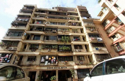 A civic agency squad accompanied by Mumbai police that set out to demolish 140 illegal flats in the Campa Cola Housing Society here returned without taking any action as the beleaguered residents opposed their entry into the complex Friday. PTI photo