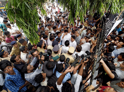 Campa Cola residents block the entrance for the BMC officials who arrived to disconnect the water and electricity supply of the society, in Mumbai on Friday. PTI Photo