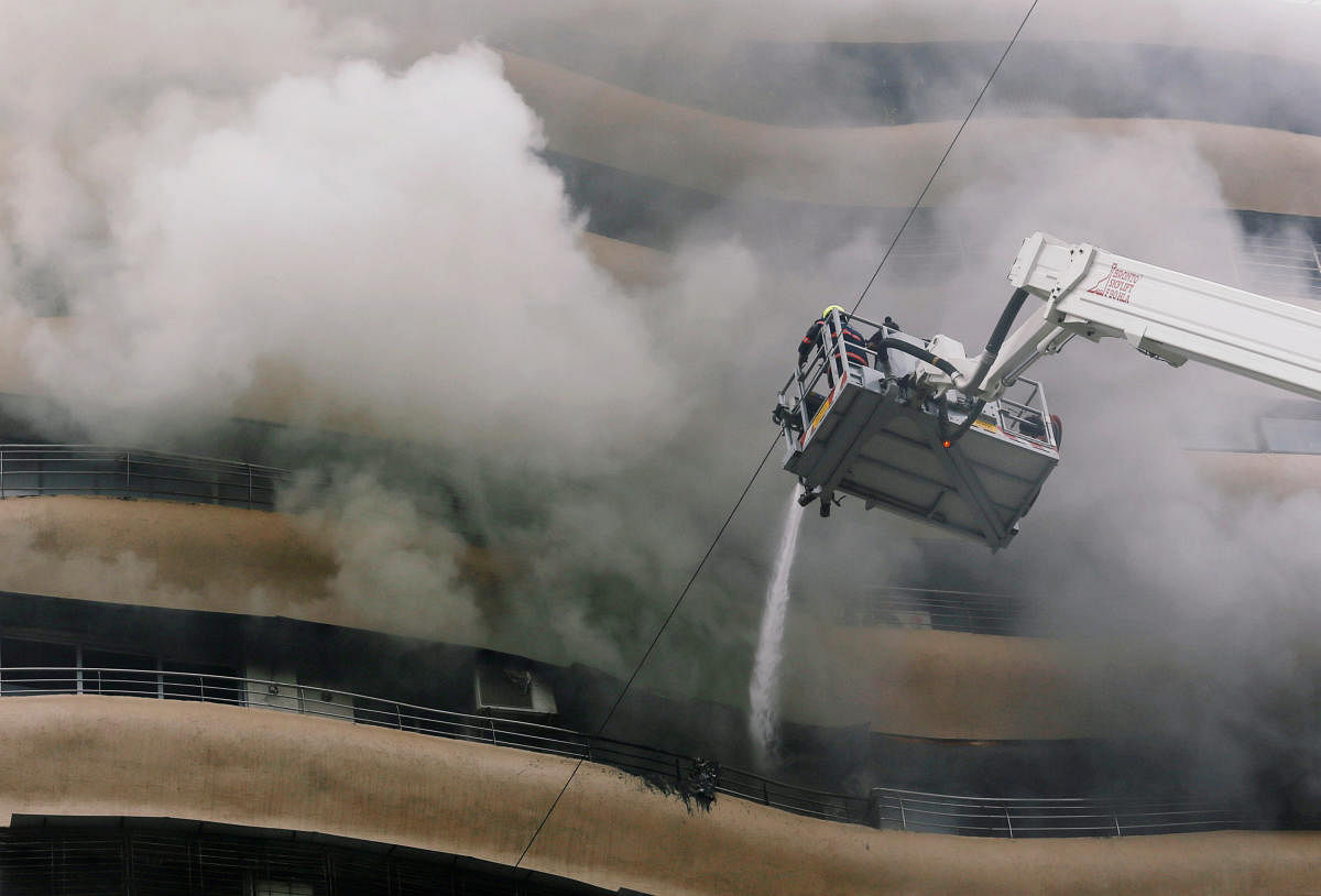 Firefighters try to extinguish a fire at a residential building in Mumbai, India. Reuters photo