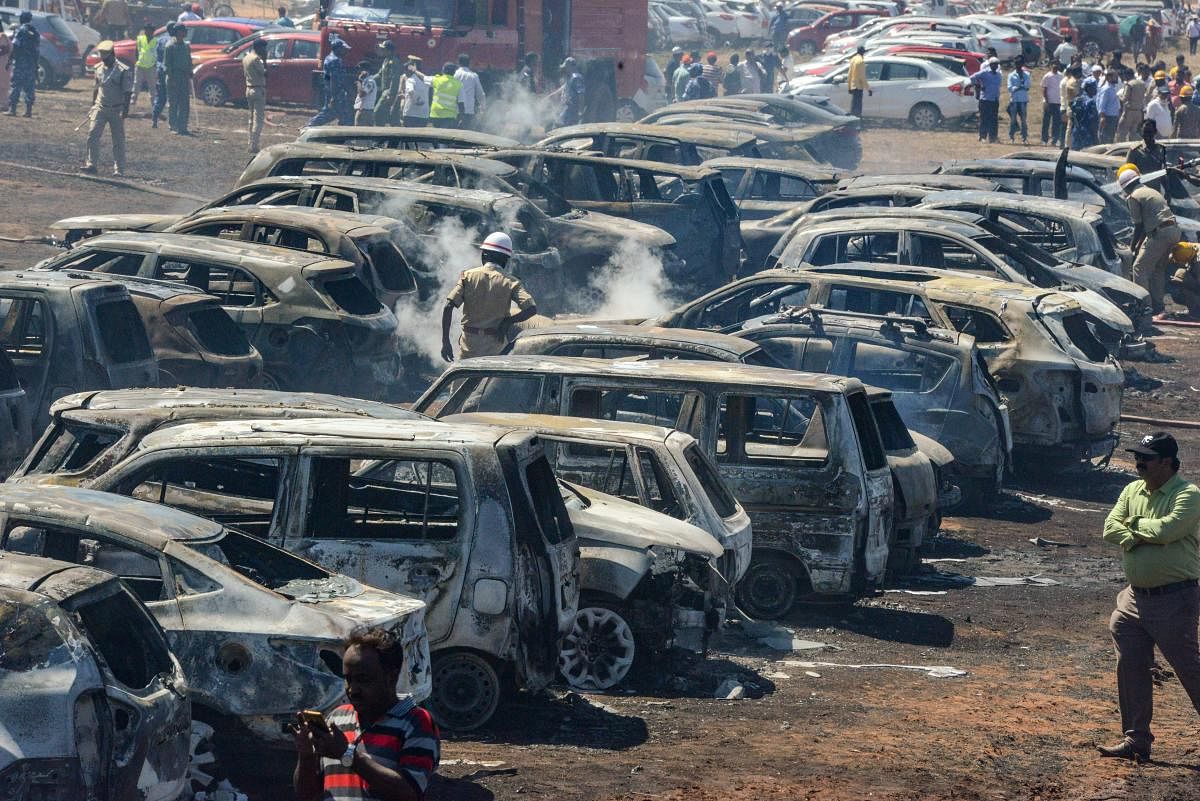 Gutted cars parking area after a massive fire on the 4th day of 12th edition of Aero India 2019, at Yelahanka Air Base in Bengaluru, on Saturday. PTI