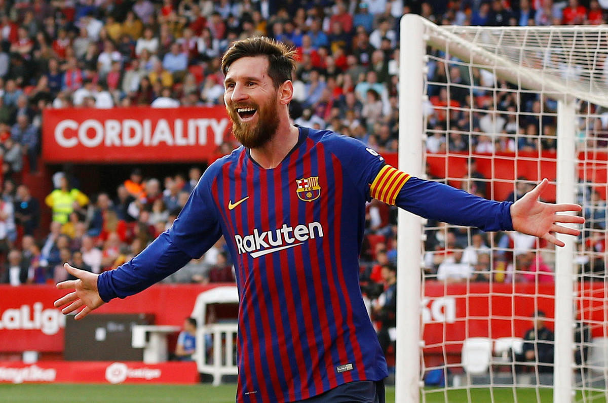 Barcelona's Lionel Messi celebrates after completing his hat-trick. REUTERS