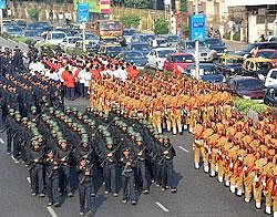 Police officers march in a parade marking the first anniversary of the terror attack in Mumbai on Thursday. AFP