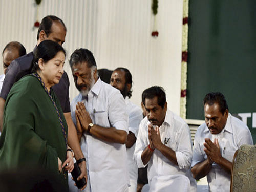 AIADMK supremo J Jayalalithaa is greeted by O Panneerselvam and other party leaders after she took oath as Chief Minister of Tamil Nadu during a swearing-in ceremony at Madras University Centenary Auditorium in Chennai. PTI photo