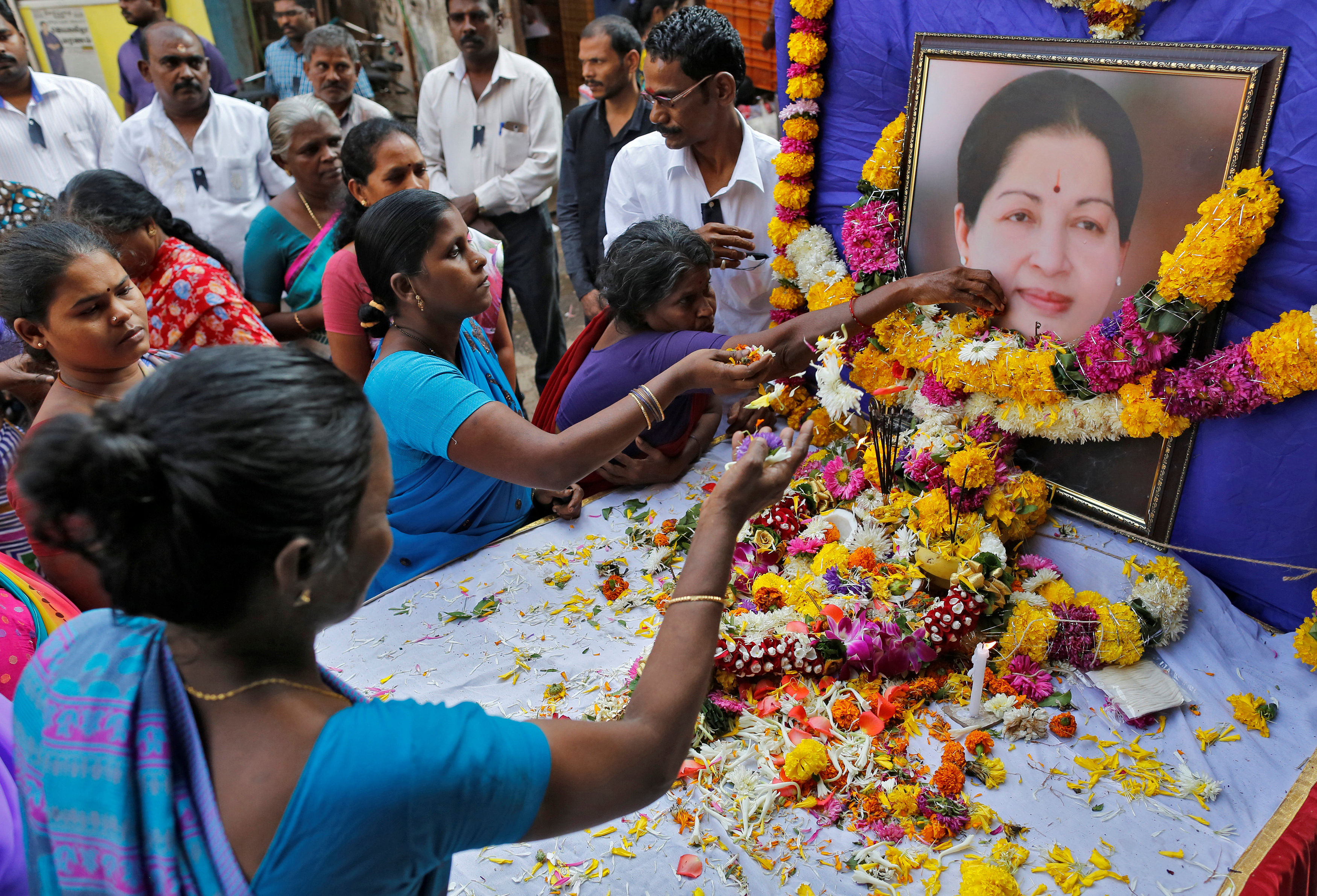 Supporters of J Jayalalithaa attend a prayer ceremony at the AIADMK party office in Mumbai. Reuters