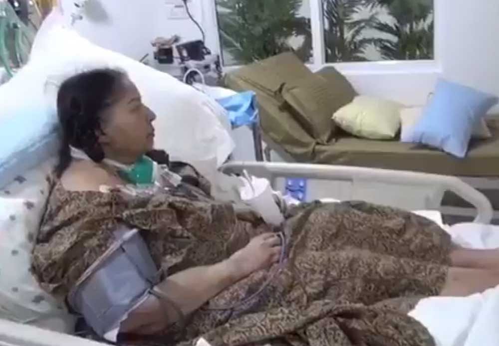 A screengrab from the video, showing Jayalalithaa holding a cup of juice in her hand.