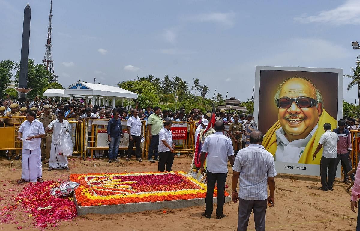 Workers decorate the memorial of late DMK president M Karunanidhi before opening for the public to pay their last respects at Anna Memorial on Marina beach, in Chennai. PTI photo