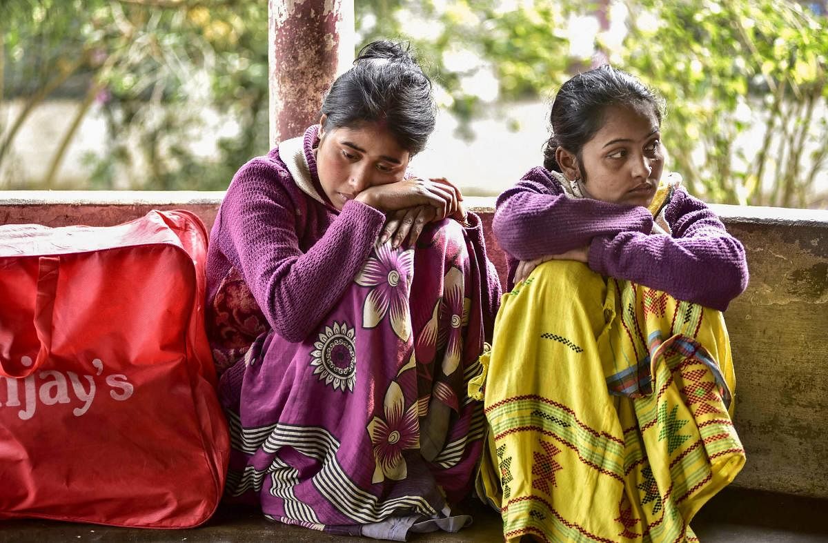 Golaghat: Relative of the victims, who died after consuming spurious liquor at a tea garden, wait at the hospital, in Golaghat, Saturday, Feb 23, 2019. At least 59 people died allegedly after the incident. (PTI Photo) 