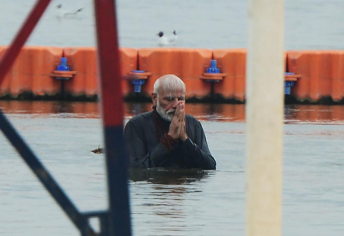Prime Minister Narendra Modi takes a holy dip at Sangam during the Kumbh Mela festival in Allahabad on Sunday. AFP