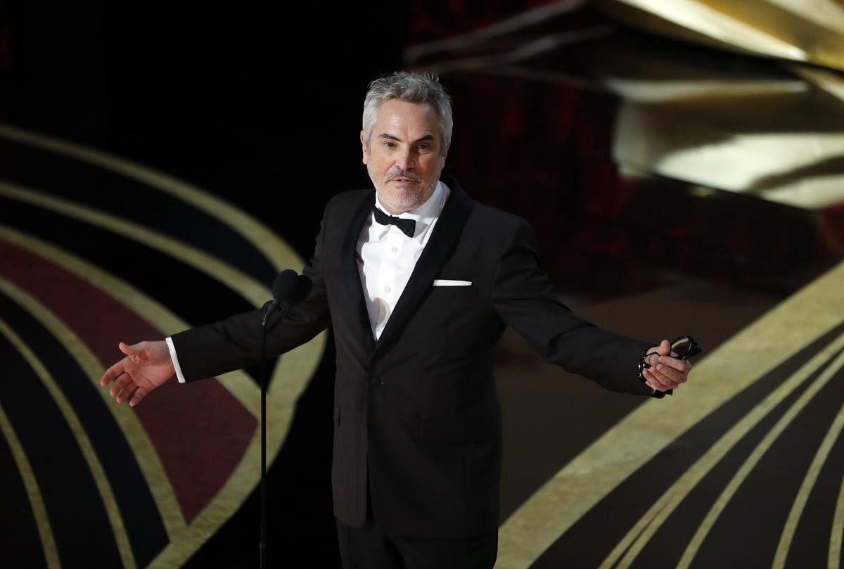 Alfonso Cuaron speaks on stage after accepting the Best Director award for "Roma". (Reuters Photo)