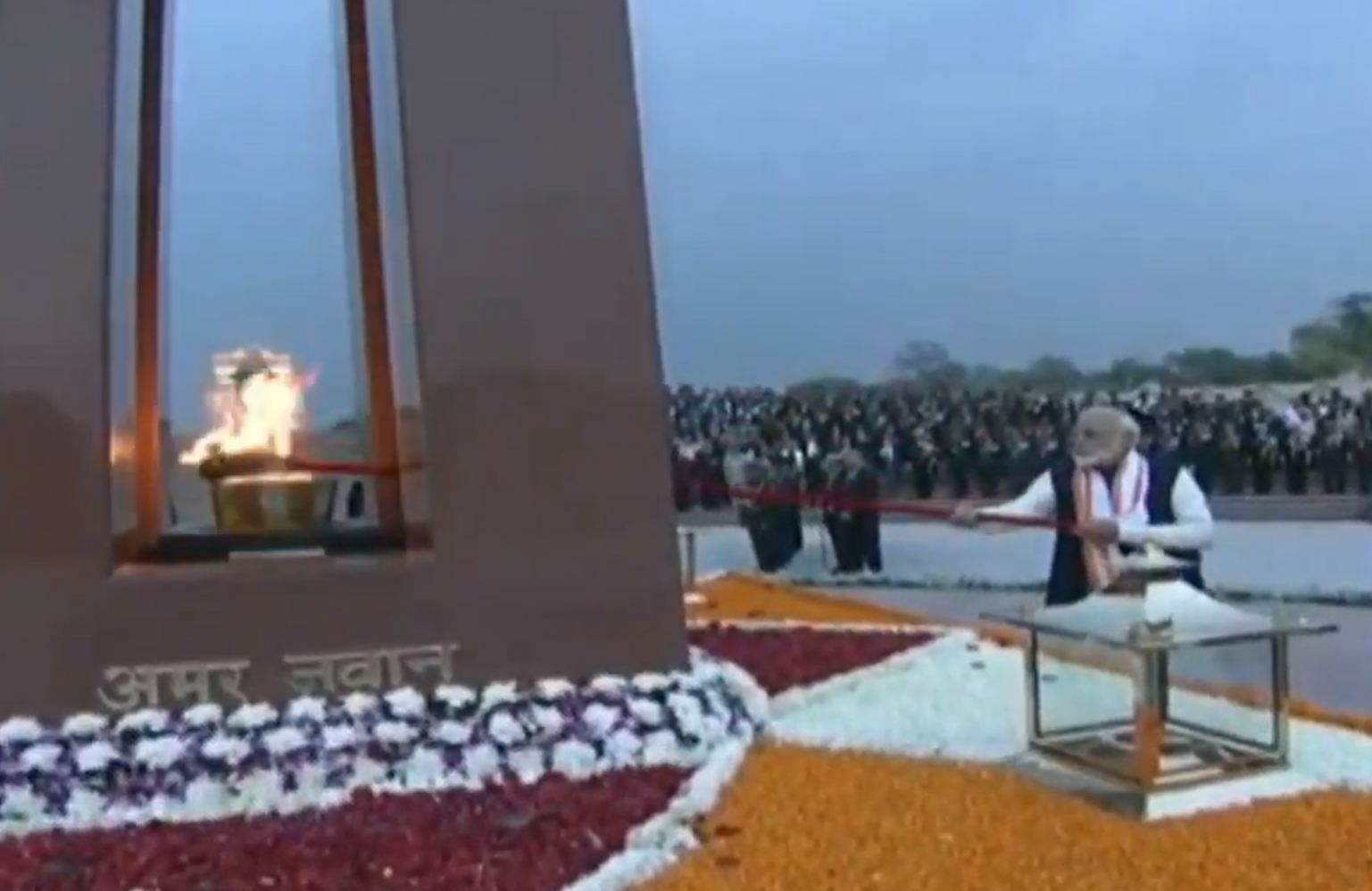 Prime Minister Naredna Modi lights the Amar Jawan Jyoti (eternal flame) in newly constructed National War Memorial in New Delhi (Video grab)