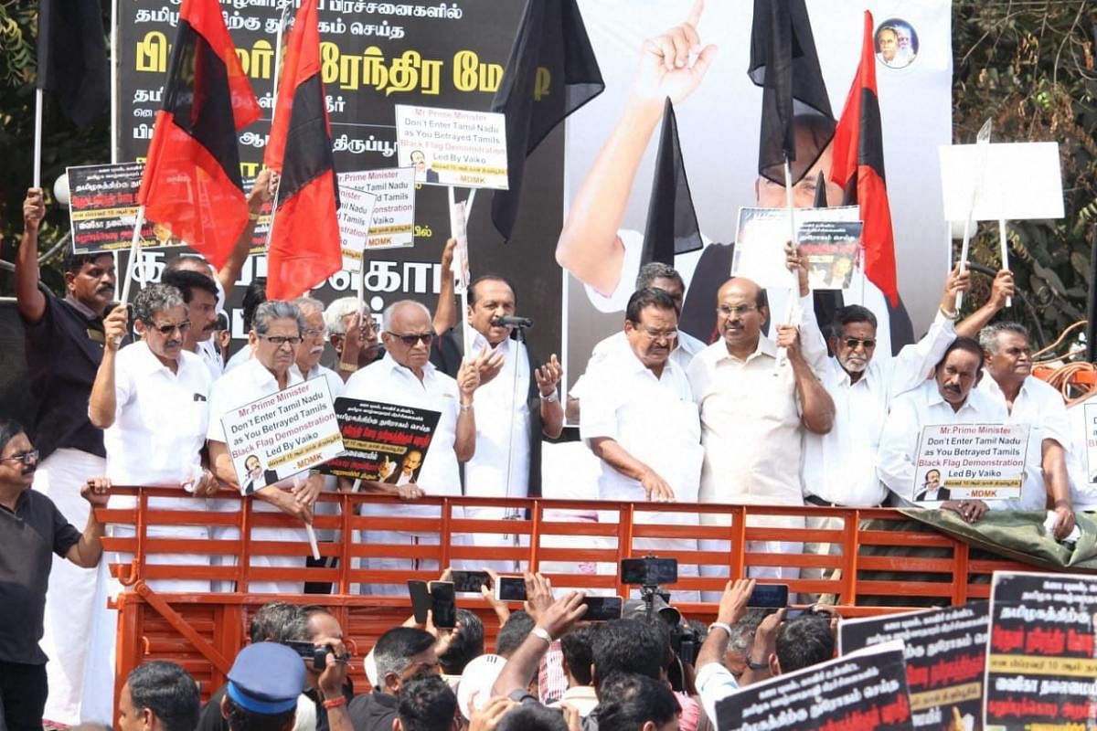 MDMK leader Vaiko with other Tamil organisation members stage a black flag to protest against Prime Minister Narendra Modi during his public meeting in Tiruppur, Tamil Nadu on Sunday. PTI