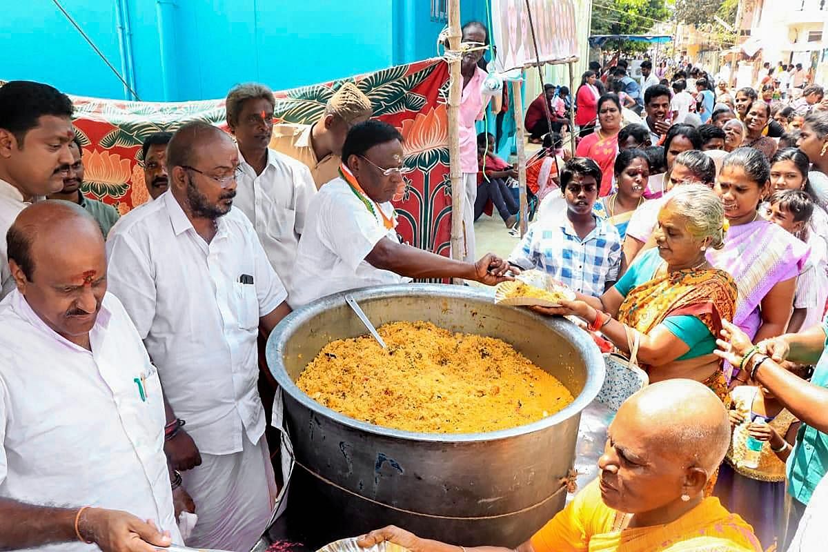 Chief Minister V Narayanasamy launches free food distribution scheme during the annual 'Maasi Magam' festival at a coastal village in Puducherry, Monday, Feb.18, 2019. (PTI Photo)