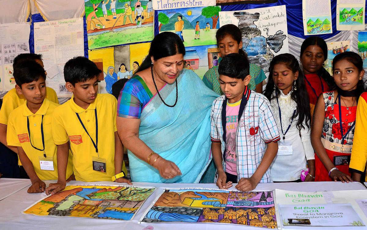 Jayamala, Minister for Women and Child Development interacts with students during the inauguration of 27th Young Environment Camp at the Bala Bhavan on Monday. DH Photo/Ranju P