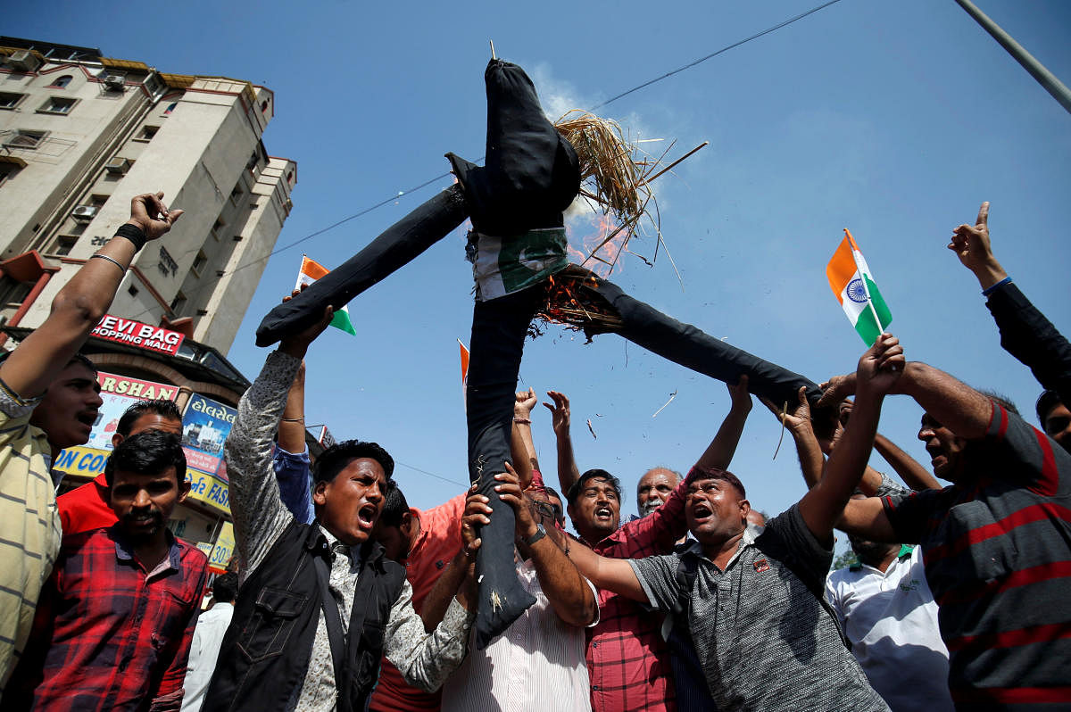 People burn an effigy depicting Pakistan as they celebrate after Indian authorities said their jets conducted airstrikes on militant camps in Pakistani territory, in Ahmedabad, India, February 26, 2019. REUTERS