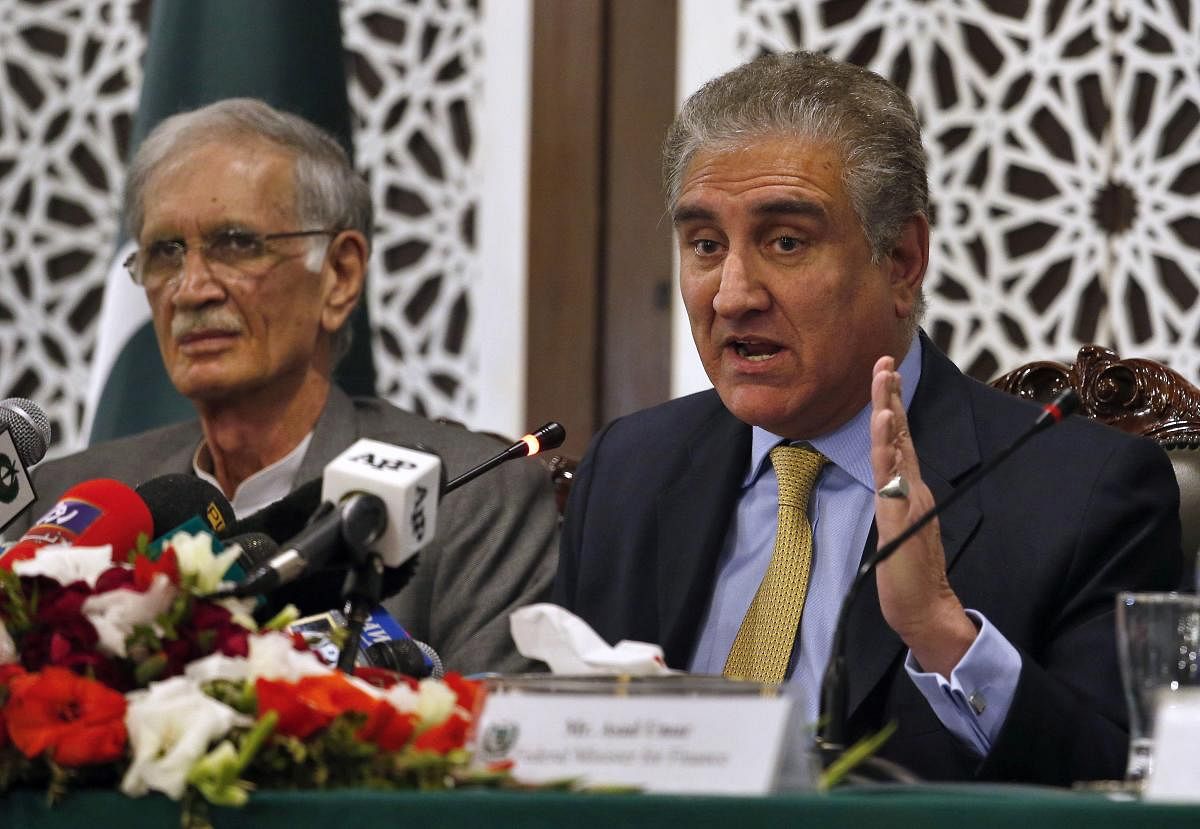Pakistani Foreign Minister Shah Mahmood Qureshi, right, gives a press conference with Defense Minister Pervez Khattak after a recent Indian airstrike, in Islamabad, Pakistan. AP/PTI photo