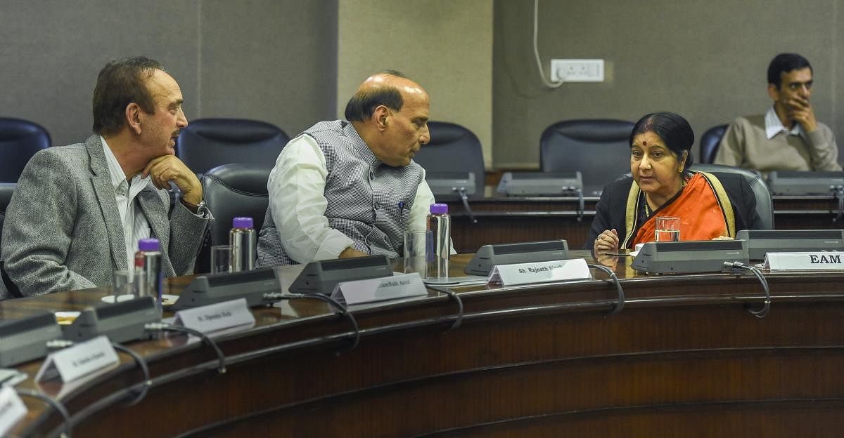 External Affairs Minister Sushma Swaraj interacts with Home Minister Rajnath Singh and Congress leader Ghulam Nabi Azad at an all-party meeting after IAF's pre-dawn strike on JeM camp, at Jawahar Lal Bhawan, in New Delhi, Tuesday, Feb 26, 2019. (PTI Photo
