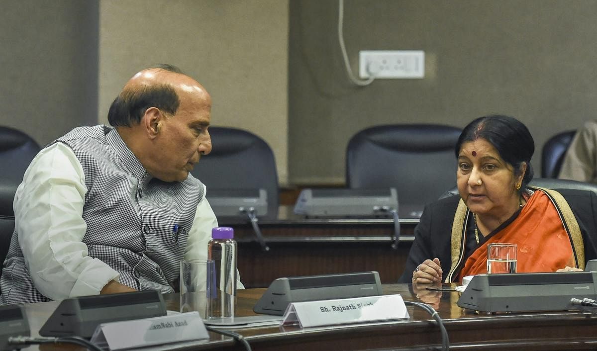 External Affairs Minister Sushma Swaraj interacts with Home Minister Rajnath Singh at an all-party meeting after IAF's pre-dawn strike on JeM camp, at Jawahar Lal Bhawan, in New Delhi. (PTI Photo)